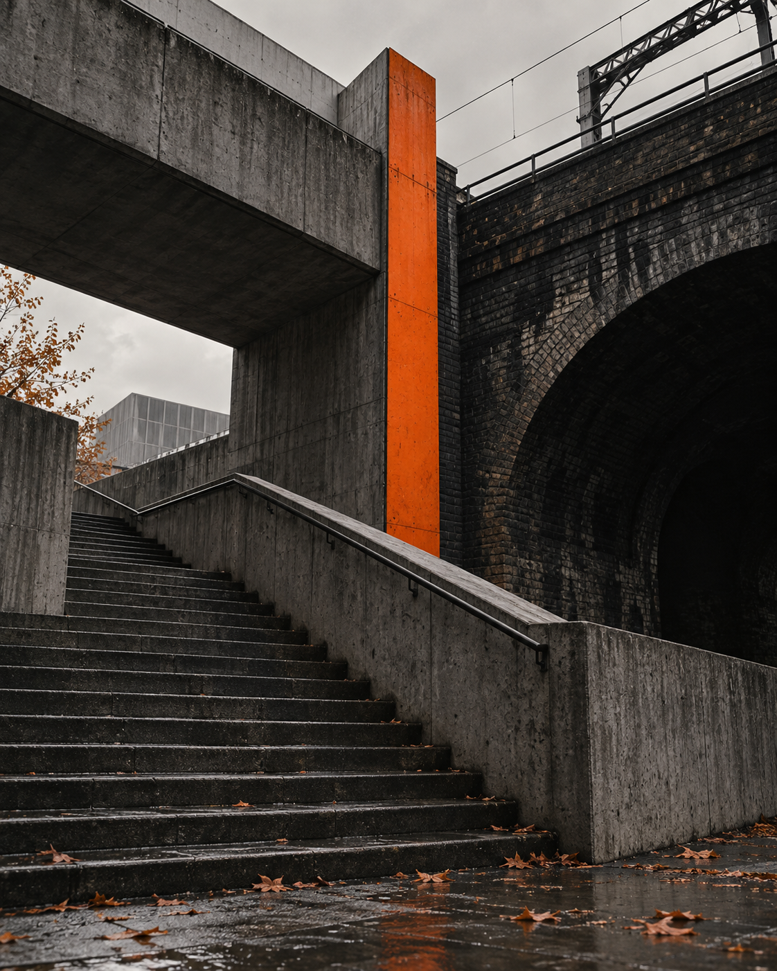 London-inspired concrete stairway and railway arch with an orange architectural detail